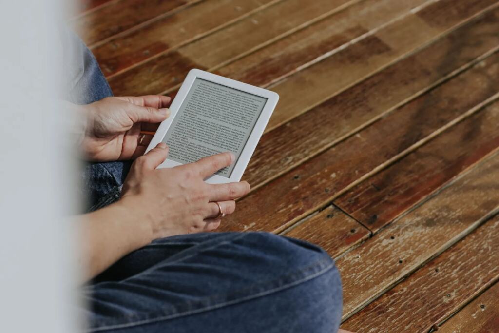 Person reading technology news on a tablet